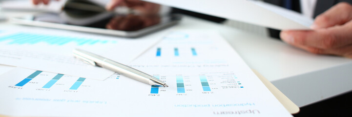 Financial statistics documents ball pen