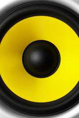 Yellow speaker loudspeaker close-up part of a musical column