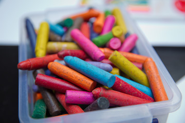 Crayons on the table. Montessori wood color gamut . crayon and paper photos on the table, colorful theme backgrounds, drawing theme wallpapers. Plastic box
