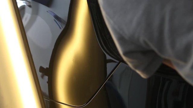 rectification of dents on the metal surface of the car. Metal heating, reflection on the car