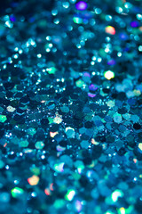 Abstract background of bright deep blue glitter texture with bokeh