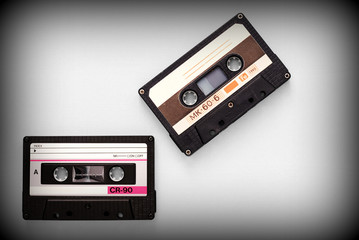 Fototapeta premium Audio tape cassettes on a gray background close-up, top view. Old Technology Concept