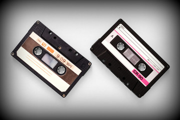Fototapeta premium Audio tape cassettes on a gray background close-up, top view. Old Technology Concept