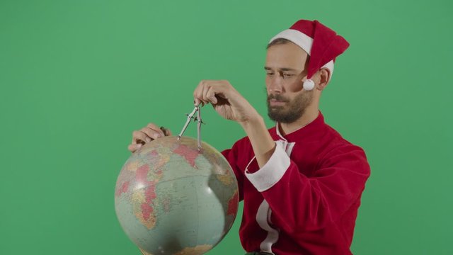 Adult Man Santa Claus Mesuring The Globe