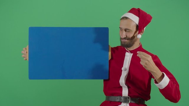 Adult Man Santa Claus Making Something Appear On A Board