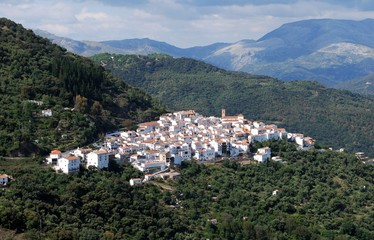 Fototapeta na wymiar Elevated view of the white town and mountains, Algatocin, Andalusia, Spain.