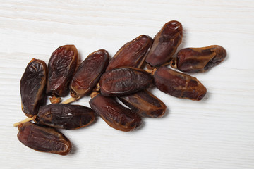 Dried dates on a branch.