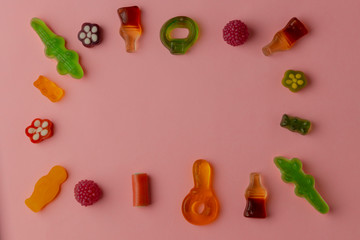 .Jelly candies on a pink background. Copy space. Top view. Flat lay.
