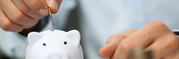 Hand businessman putting pin money