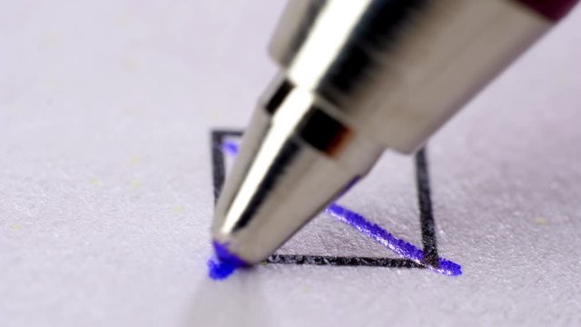 Ball pen putting crosses in tick box.