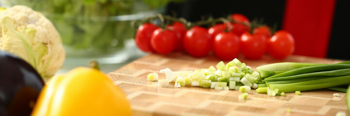 Cook holds knife in hand and cuts on