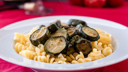 Italian food: pasta with zucchini and parmesan