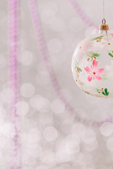 Christmas ball toy weighs on blurred background