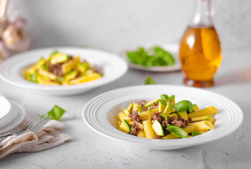 Delicous pasta with beef and fresh avocado