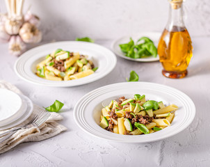 Delicous pasta with beef and fresh avocado