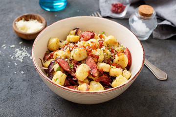 Homemade gnocchi with smoked sausage and bacon.