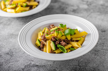 Delicous pasta with beef and fresh avocado