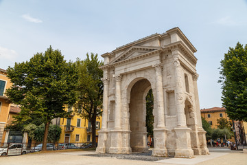 Fototapeta na wymiar VERONA / ITALY - JULY 2015: Ancient Roman Triumphal arch in the historic centre of Verona, Italy