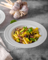 Delicous pasta with beef and fresh avocado