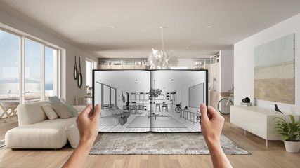 Hands holding notepad with creative living room design blueprint sketch drawing. Real interior design project background. Before and after concept, architect designer work flow idea