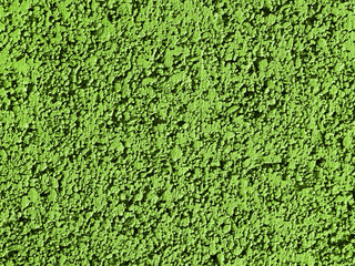 Green background facade plaster. Monolithic plaster decorative backdrop. Single layer scraped cement plaster wallpaper. Concrete exterior building structure backdrop. Silica sand cement wall plaster