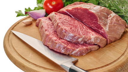 raw meat with vegetables and knife