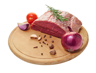 raw meat with vegetables and seasonings on the board