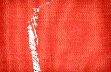 Ripped red wool fabric