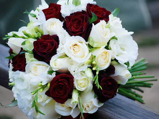 Round Bridal Bouquet of Red and White Rises and Freesias. Classic Design Wedding Flowers. 