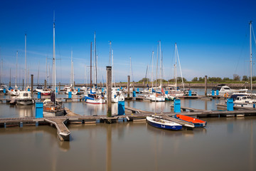 Fototapeta na wymiar boats in the harbour, Bensersiel, Leybucht, Krummhörn, East Frisia, Lower Saxony, Germany, Europe