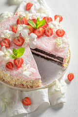 Fresh strawberry cake decorated with summer flowers