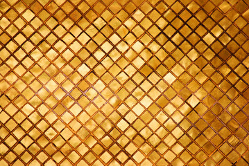 Abstract - Sculpture of golden wall  texture spuare patterns of pagoda at Wat Phra Si Rattana...