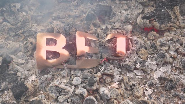 An abstract bet burns in a fire on hot coals. Sign of loss or end. Destruction and disappearance of the word rate. Unfulfilled and ruined plans and dreams.