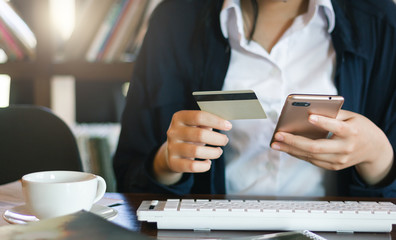 Businesswoman using mobile phone to payment or shopping online with credit card