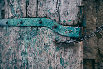 Details of wooden door background with iron chain