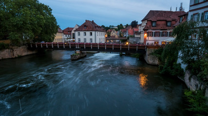Fototapeta na wymiar Series of bridges and buildings on the various branches of the Regnitz river in Bamberg