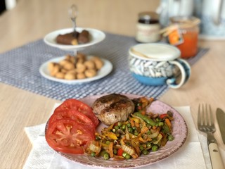 fried vegetables and beef cutlet