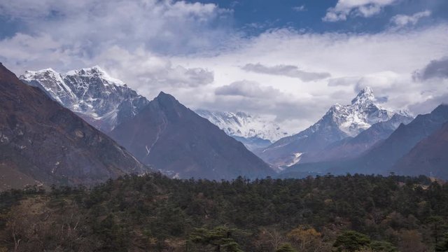 Ama Dablam and Taboche Mountains on Sunny Day. Blue Sky. Himalaya, Nepal. Timelapse