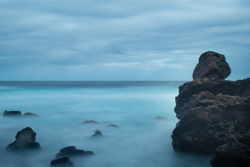 Fototapeta na wymiar Rocks and bicolor sea
