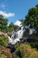 Beautiful landscape view of waterfall in Thailand with blue sky