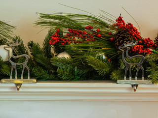 Christmas fireplace hanger reindeer with green garland cherry and bauballs panorama