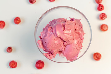 Pink cherry cream for cake. Sweet cream in glass bowl. Confectionery, sweet life, calories.