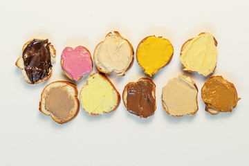 Assorted sweet cream on baguette. Confectionery, sweet life, calories.