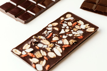 Handmade chocolate, assorted dark chocolate with nuts and goji berries.