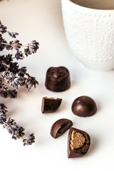Handmade chocolate, assorted dark chocolate with nuts and goji berries. Coffee sweets.