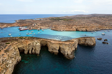 Fototapeta na wymiar Aerial drone shot of Blue lagoon Gozo Malta Comino island. Best beaches of Mediterranean