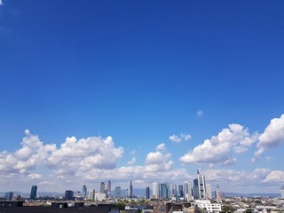 view of city with blue sky and clouds