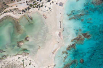 Aerial drone shot of beautiful turquoise beach with pink sand Elafonisi Crete Greece. Best beaches of Mediterranean