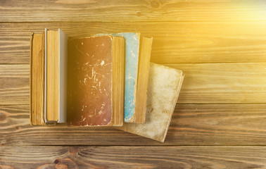 A lot of old books on wooden background. Top view