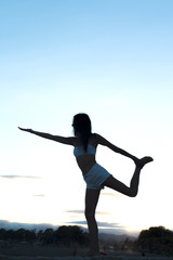 Young athlete girl doing yoga asanas